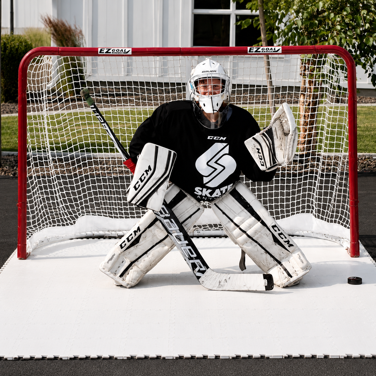Photo of a hockey goalie in a goal