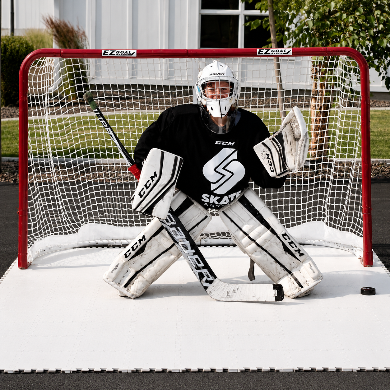Photo of a hockey goalie in a goal